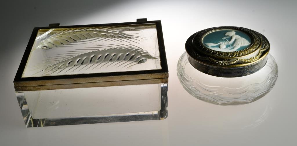 (2) Pcs Glass & Silver Plate Dresser Boxes: To include a rectangular glass box with molded sprays and silver plate mounted lid, along with a round etched glass box having a jasperware and silver plate lid, having unidentified hallmarks, largest