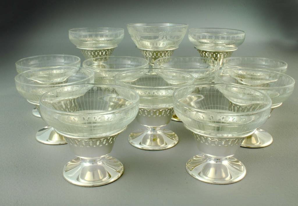 (12) Pcs Breadner MFG Co. Plate & Etched Glass Sorbets: Includes etched glass bowls with simple line design, silver plate stands have pierced design at rim, underside hallmarked BMC, EPNS and N11, measure 3.1"H x 3.6"D, circa 20th century. One stand with r