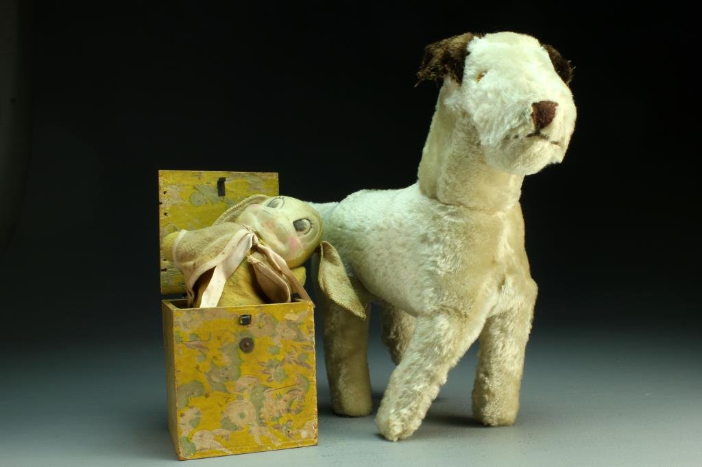 (2) Pcs Antique Jack in the Box & Stuffed Animal: To include a stuffed animal dog with glass eyes, retaining partial tag, along with a floral paper covered wood jack-in-the-box, interior containing cloth rabbit on spring with painted face, largest me