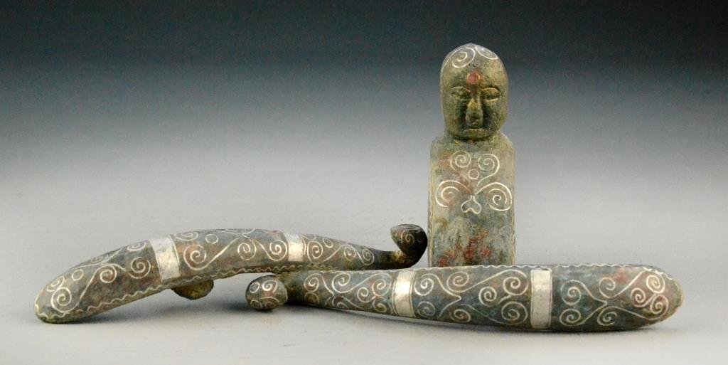 (3) Pcs. Chinese Archaic Style Bronze: To include two bronze belt hooks together with a seated bronze figure all in laid with silver colored metal, belt hooks measure 5.75"L. Property of a Rochester Hills, Michigan Gentleman.