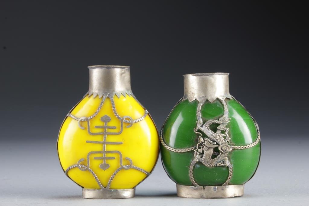 (2) Chinese Peking Glass Snuff Bottles: Having metal fixtures depicting four clawed dragons and symbols, bases with worn character marks, tallest is 2.9"H.