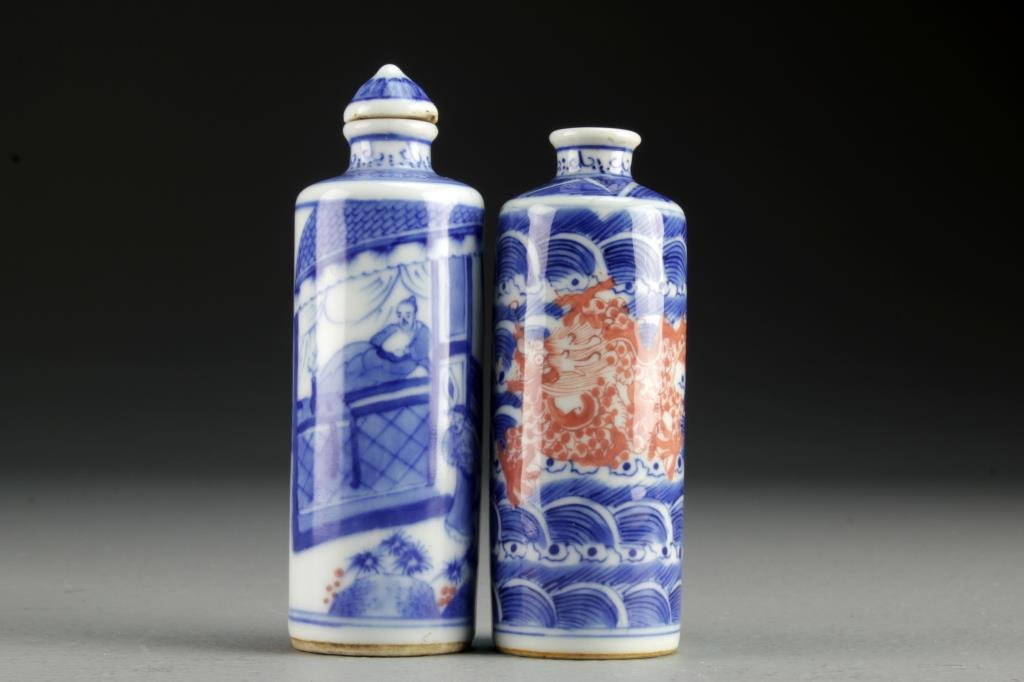 (2) Chinese Blue and White Porcelain Snuff Bottles: Two large cylindrical examples, one finely painted to depict five clawed dragons with scalloped background design, bases bearing two character mark in underglaze blue, the second example painted to de