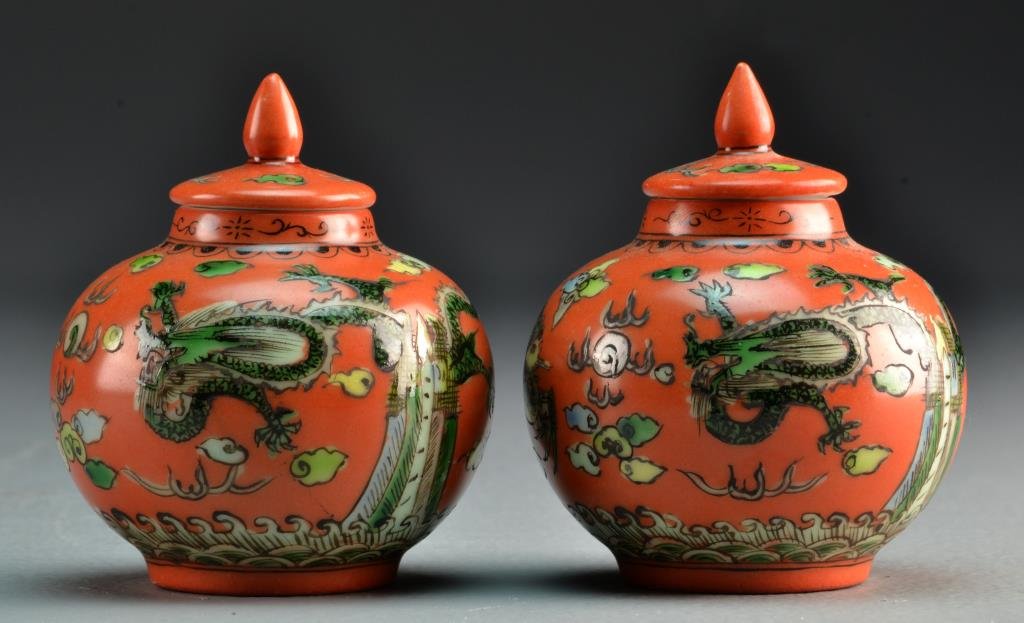 (2) Chinese Painted Porcelain Mini-Urns: Pair of covered mini-urns having finials, painted with similar depiction of phoenix, five clawed dragon, flaming pearl and ruyi clouds, bases bearing four character mark in underglaze blue, both measu