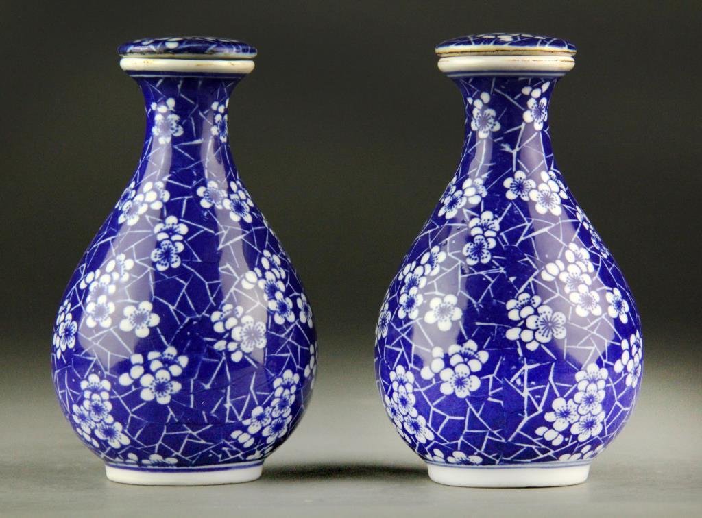 Pair of Chinese Blue & White Porcelain Covered Jar: Matching bulb-shaped blue and white jars with overall blossom decoration and flat stopper-type lid, 5.75" Diameter, circa 20th century, good condition in protective brocade box.