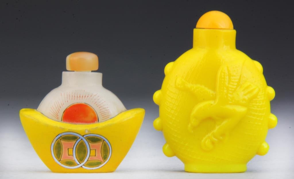 (2) Pcs Chinese Glass Snuff Bottles: To include a finely painted bottle depicting overlapping coins and a sunset, and a canary yellow glass bottle depicting birds, largest measures 2.75"H.