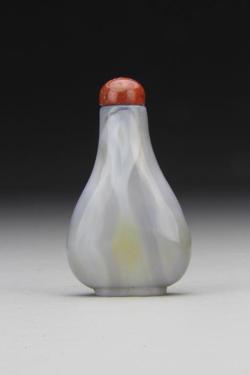 Chinese Carved Agate Snuff Bottle: Finely polished and carved of simple form to show natural properties of stone, complete with stopper, 2.75"H. From the collection of David Bell who worked for an Italian steel company in China during 