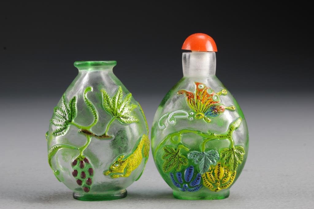 (2) Chinese Peking Glass Snuff Bottles: Two clear glass examples with painted overlay, one depicting butterfly with gourds, the other depicting squirrel and grapes, tallest is 2.9"H.