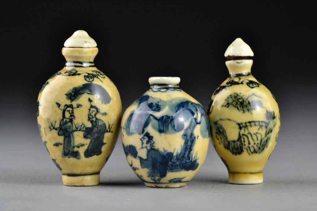 (3) Chinese Blue and Celadon Porcelain Snuff Bottles: Two having a scrolling leaf border to sides, one painted at center to depict landscape scenes with a bridge and an ancient tree, the other depicting figures within a landscape, along with a bulbous ex