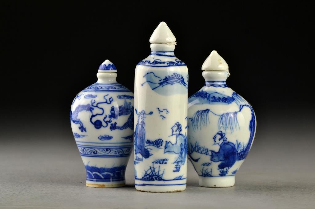 (3) Chinese Blue and White Porcelain Snuff Bottles: Two painted to depict figures in landscape scenes including a rider on horseback, the other depicting three clawed dragons chasing flaming pearls among ruyi clouds, bases bearing leaf mark, seal and c