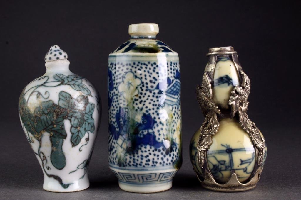 (3) Chinese Porcelain Snuff Bottles: To include a blue and celadon example of gourd form, painted with landscape scene and having phoenix metal overlay, base stamped by four character mark within a worn square, one blue and celadon examp