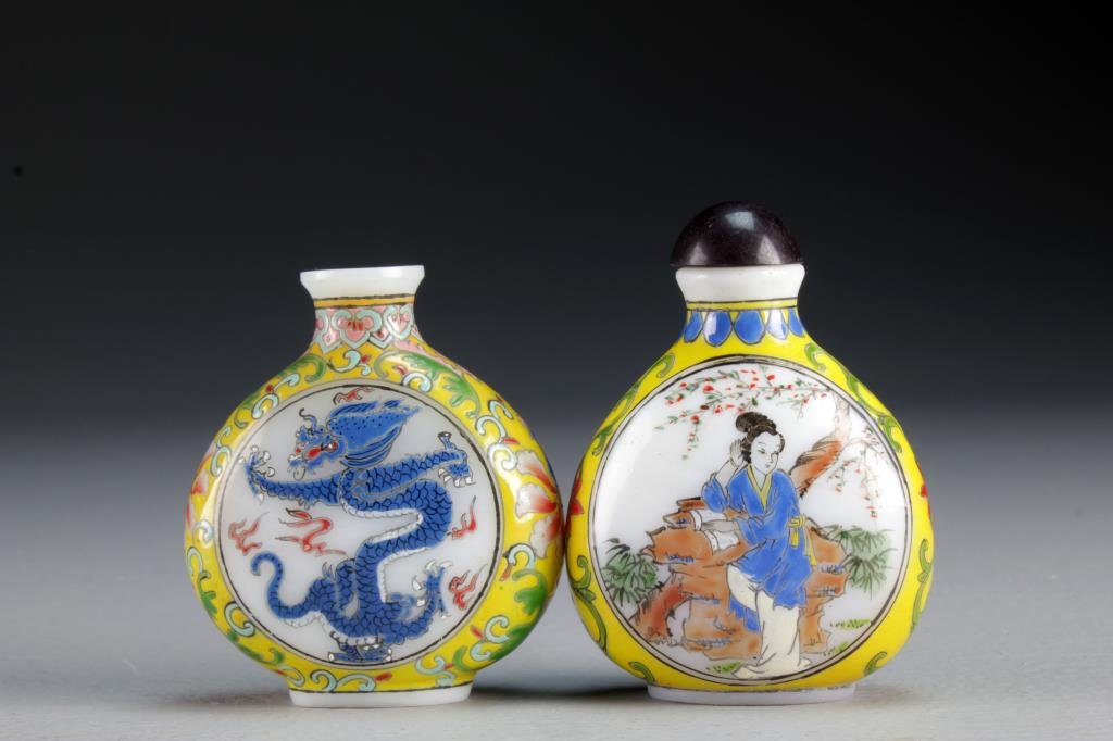 (2) Chinese Peking Glass Snuff Bottles: One finely painted at center to depict beauties in landscape scenes, the other depicting five clawed dragon, each having scrolling floral border, bases bearing three character marks in blue and red, t