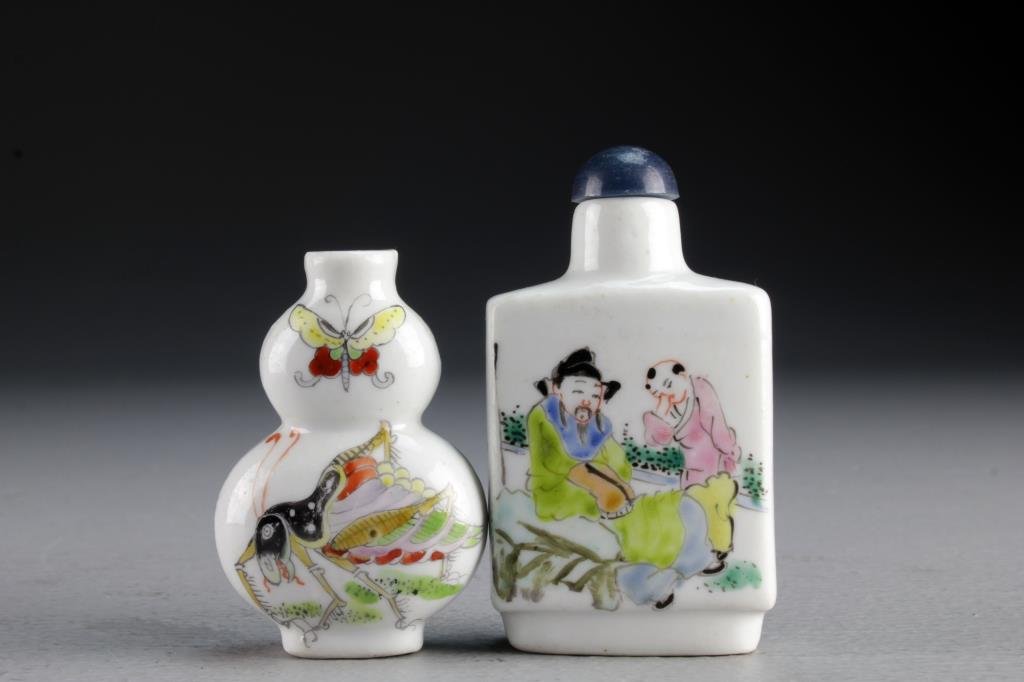 (2) Chinese Famille Rose Porcelain Snuff Bottles: One finely painted to depict figures in landscape scenes with a base bearing three character mark in underglaze iron red, the second example formed as gourd and painted to depict a cricket and butterf