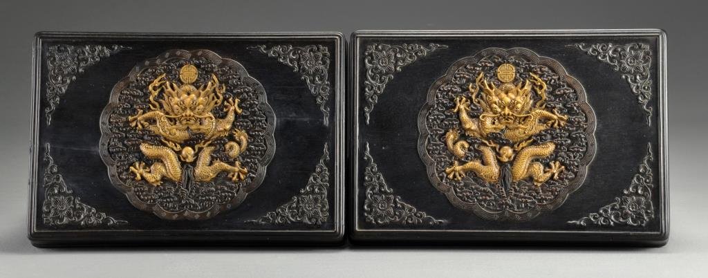 Pr. Chinese Boxwood Inlaid Zitan Boxes: Having finely carved lids inlaid with boxwood to depict five-clawed dragons playing with flaming pearls amongst ruyi clouds, the base having four character mark, 3.25"H X 9.75"W X 6.5"D. Condition: On