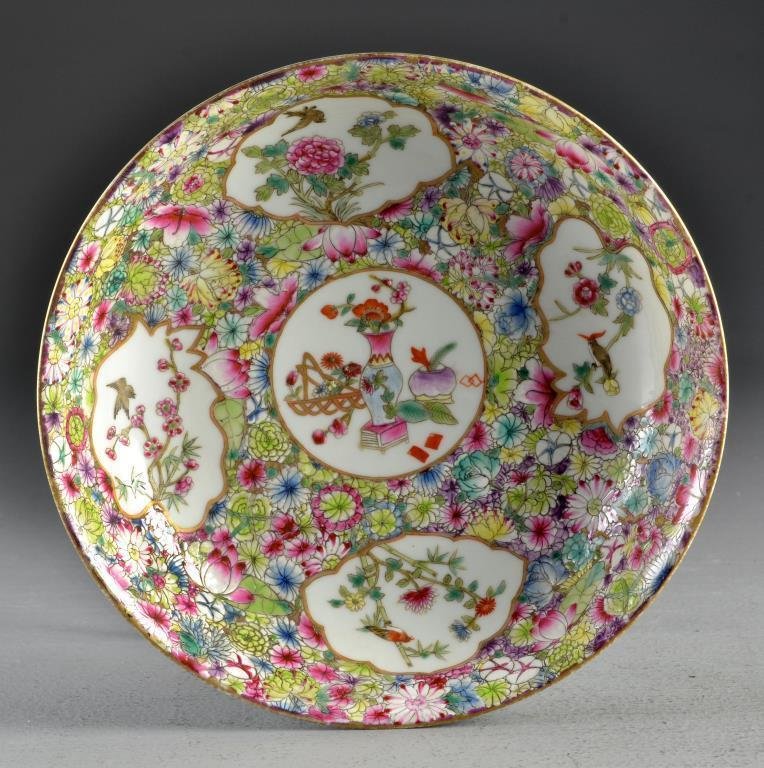 Chinese Qing Rose Medallion Porcelain Bowl: Finely painted to depict flowers and birds, the center decorated with Buddhist symbols, the balance depicting lotus blossoms and scrolling tendrils, base having Qianlong Seal mark in underglaze blue, 