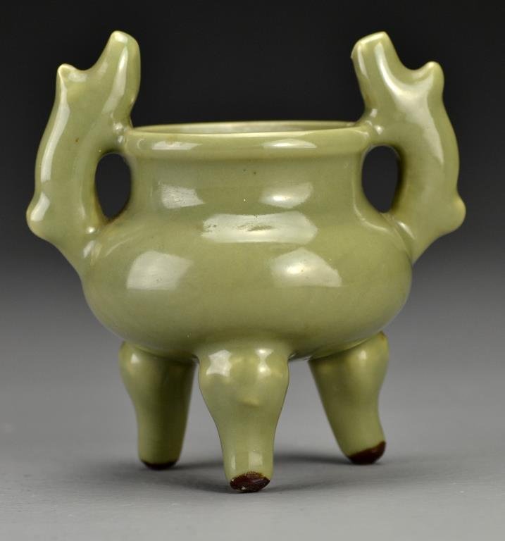 Chinese Qing Celedon Glazed Porcelain Censor: Having two shaped handles raised on tripod feet, 4.875" H circa 19th Century. Collection of the Late Robert Willis owner of R.F. Willis Galleries, Grand Rapids, Michigan.