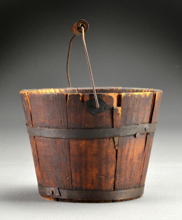 19th c. American Berry Bucket: Having stave construction, iron bands, wire bail with wood handle, marked on bottom 1850 or 1872?and in marker or paint amish lunch pail etc. 4"H x 5.5"D. Condition, some loose staves, areas of wood l
