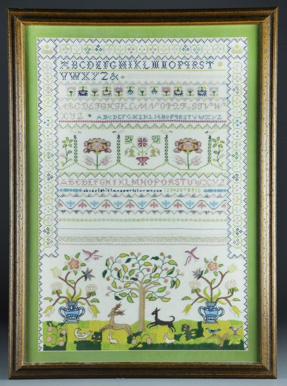 An American Schoolgirl Sampler: A schoolgirl sampler decorated with tree, flowers, birds and deer design, apparently unsigned, measures 27.25"H x 20.25"W overall,circa mid-20th century.
