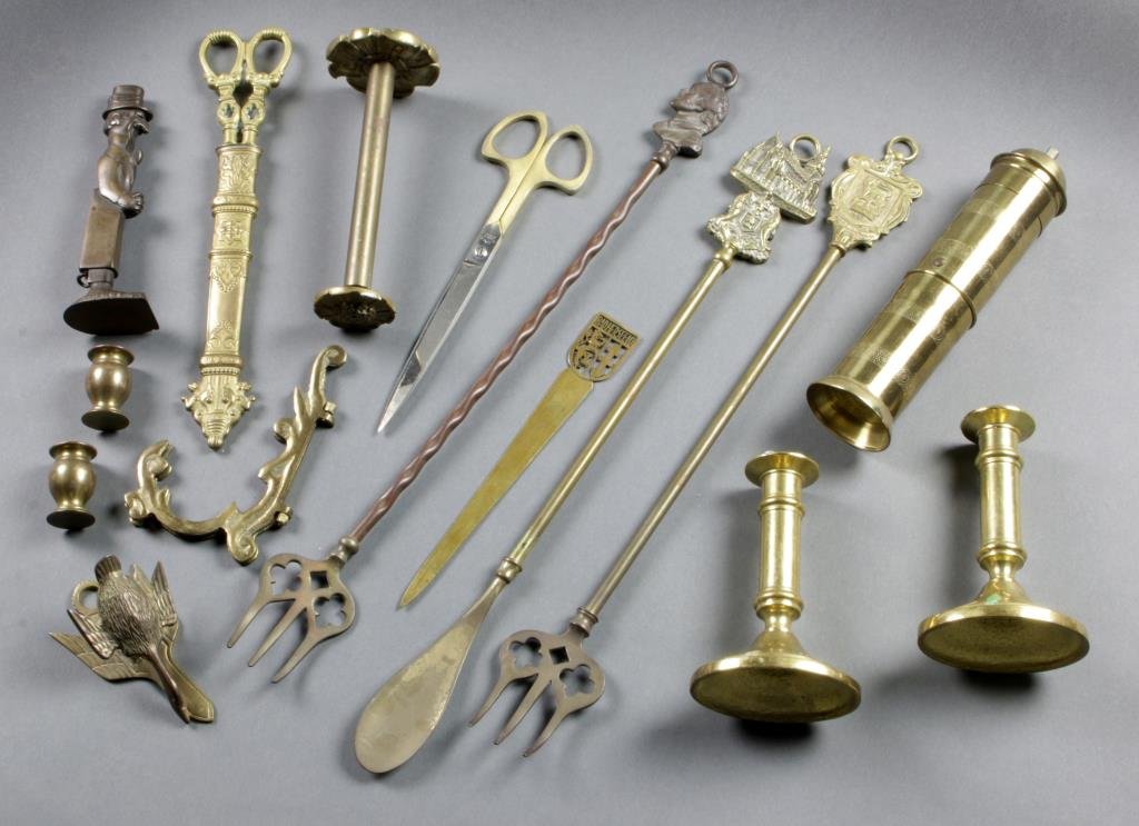 (15) Assorted Brass Articles: An assortment of brass articles, some include scissors stamped Germany, fireplace items, letter opener, candlesticks, figural Bishop & Babcock corkscrew and coffee grinder, largest measures 18"L, circ