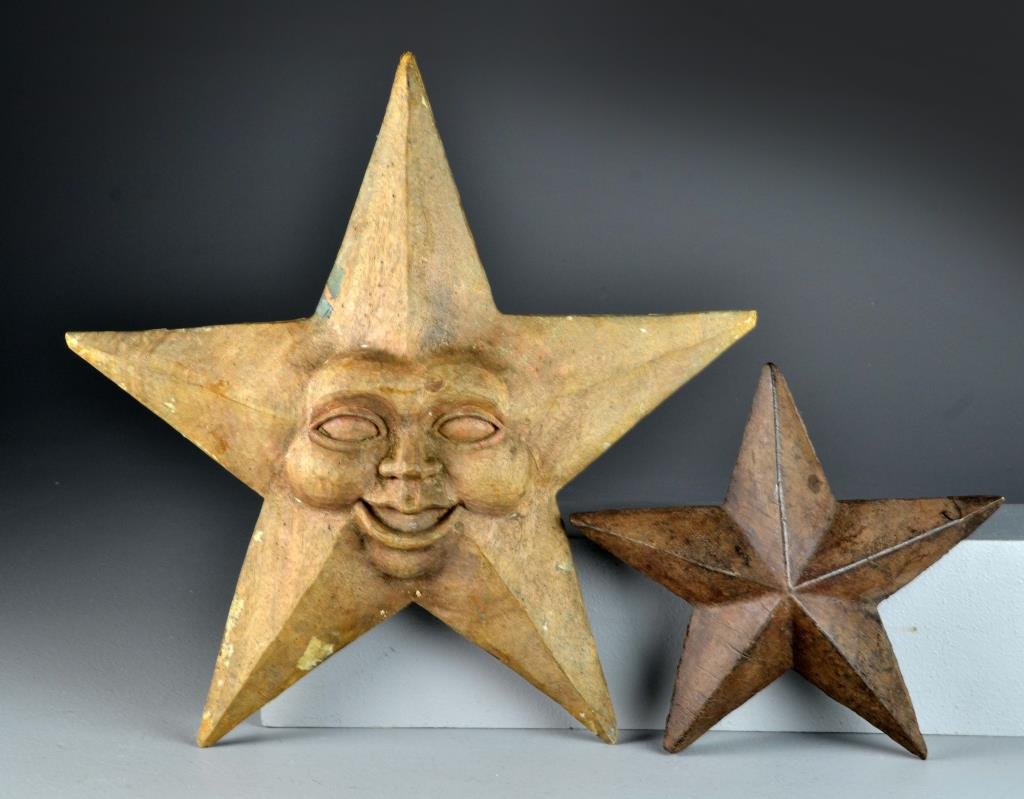 (2) South East Asian Carved Star Molds: Carved as five point stars, one with a face, made in Indonesia, likely papier-mache molds, largest measures approximately 18"H, circa 20th century. Condition: having surface wear including some rough 