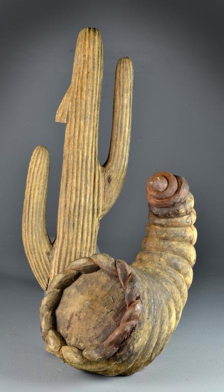 (2) South East Asian Carved Wood Molds: Depicting a cornucopia and a cactus, made in Indonesia, likely papier-mache molds, largest measures approximately 23"H, circa 20th century. Condition: cornucopia with restoration to tip, some areas of