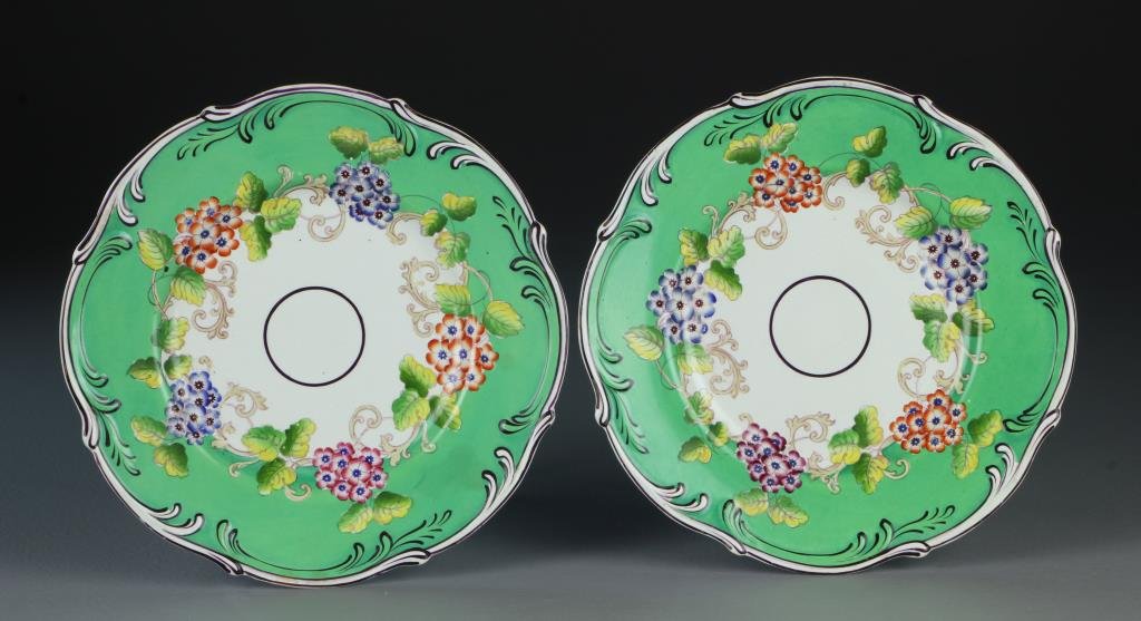 Pr. Mintons Porcelain Plates: Hand painted to depict multi-colored flowers against a mint green with black trim, each numbered in purple "5215", measure 9"Dia., circa 1830-1850. Property of a Birmingham, MI family.