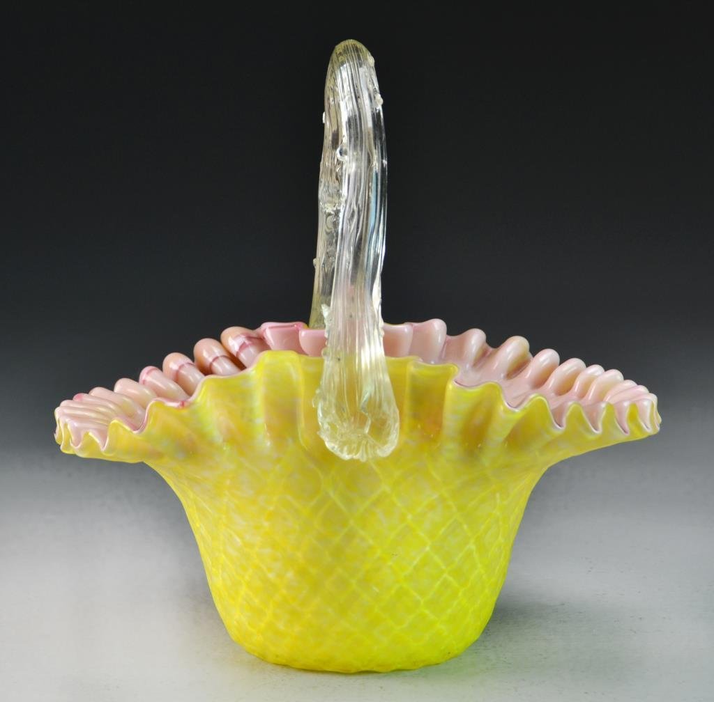 A Victorian Art Glass Basket: Formed as a basket with a thorn handle, having a ruffled edge and cross hatch textured exterior, polished pontil to base, apparently unsigned, measures 9.5"H x 9.25"W, circa late 19th century. Propert
