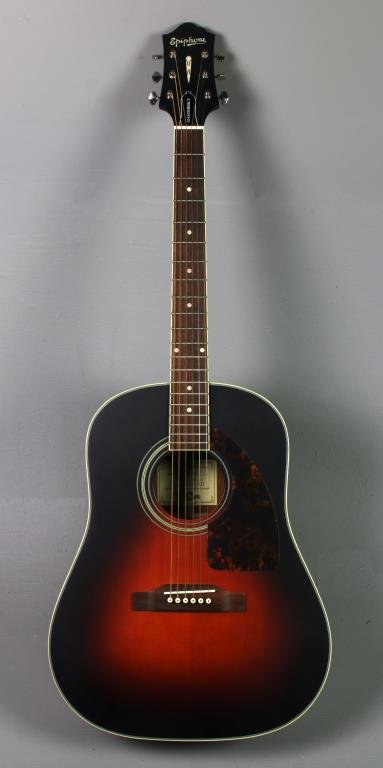 Epiphone Masterbilt Acoustic Guitar: Having a sold sitka spruce body, mahogany neck and rosewood fingerboard in the "Vintage Sunburst" finish, model AJ-500M, number GR-05040510, complete with Epiphone Masterbilt case with dial lock and a