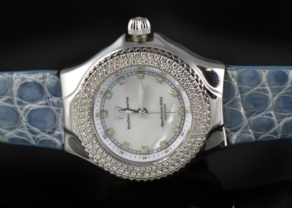 Women's TechnoMarine TechnoLady Diamond Watch: A ladies' wristwatch having a diamond set bezel, a Mother of Pearl dial and a stainless case, with three interchangeable bands in lizard, alligator and possibly satin, circa late 20th century. We do n