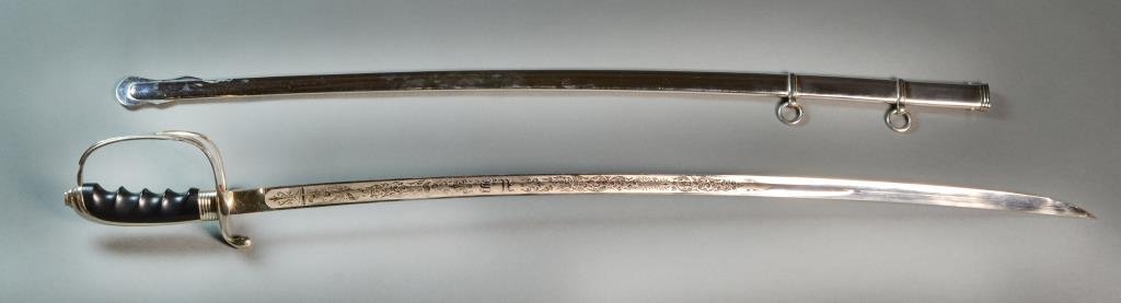 US Army Officer's Dress Sword & Scabbard: Having a black handle and blade marked "Germany", each side of blade heavily embossed with patriotic markings including an American eagle, scabbard marked "92", model 1905, purportedly made in Germany