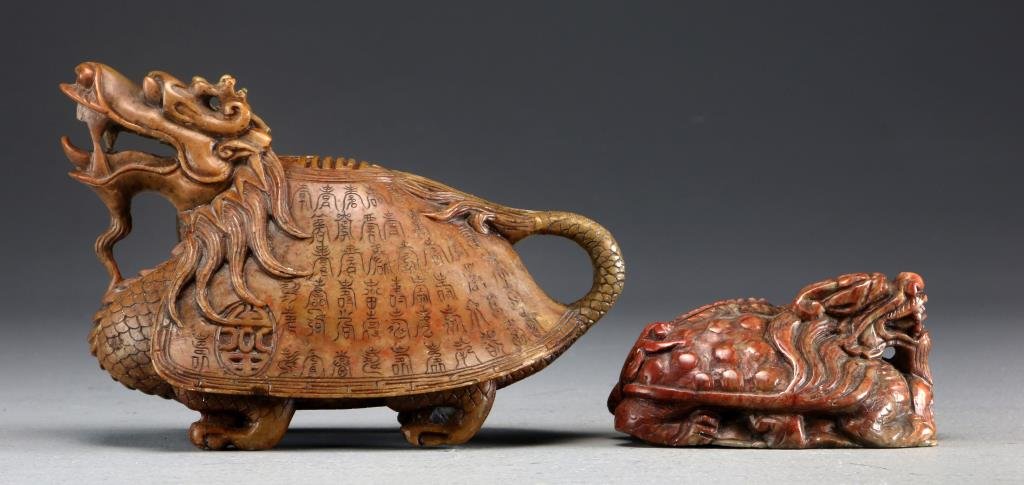 (2) Finely Carved Soapstone Dragon Turtles: To include a large example, the sides carved with Chinese characters in ancient script, together with a smaller example in molted colored stone, both carvings exhibit fine details and both initialed B