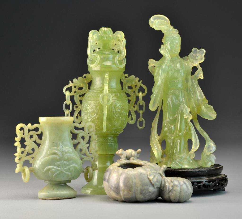 (4) Pcs. Chinese Carved Hardstone: To include a serpentine censer hung with chains and loose rings, a serpentine statue of Guanyin, a small archaic style vase with carved open work and loose rings, and a soapstone brushwash carved as a