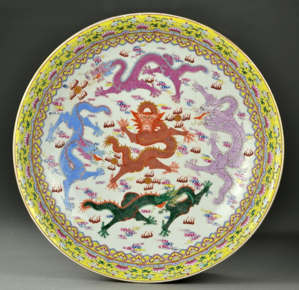 Large Chinese Famille Rose Porcelain Charger: Finely painted to depict five, five-clawed dragons amongst ruyi clouds contesting flaming pearls, the exterior similarly painted, base having seal mark in iron red underglaze, 3.5"H X 16"D. Possibly Q