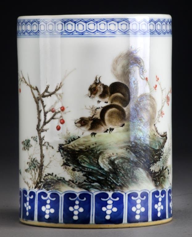 Chinese Famille Rose Porcelain Brush Holder: Depicting squirrels on a rocky outcrop, having blue and white borders, 6.25"H X 4.5"D. Possibly Republican.