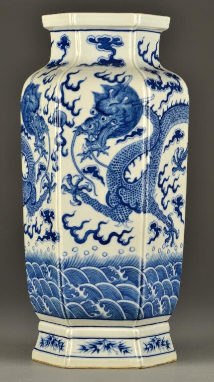 Chinese Blue & White Six-Sided Porcelain Vase: Finely painted to depict five clawed dragons contesting a flaming pearl amongst ruyi clouds and over crashing waves, base having seal mark in underglaze blue, 15.5"H.