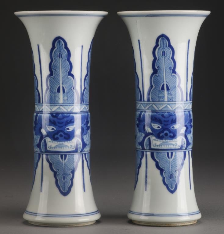 Pr. Chinese Blue & White Porcelain Vases: Painted to depict the Face of the Beast flanked by stiff petals, base having six character mark within two concentric circles in underglaze blue, 9"H.