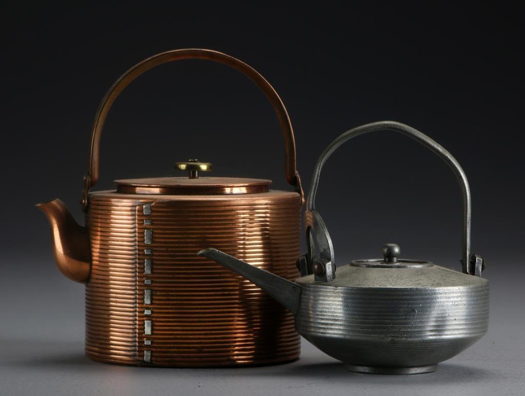 (2) Chinese Teapots Including Copper & Pewter: To include a pewter example depicting a landscape and having a ribbed body together with a copper teapot, both having calligraphy marks to base, tallest is 6.25"H. Property of a Lapeer, MI couple.