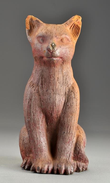 19th C. American Redware Sewer Tile Cat: Molded to depict a seated cat, having combed decoration, in redware, measures 11"H, circa 19th century. Condition: loss to each ear and small loss to nose.