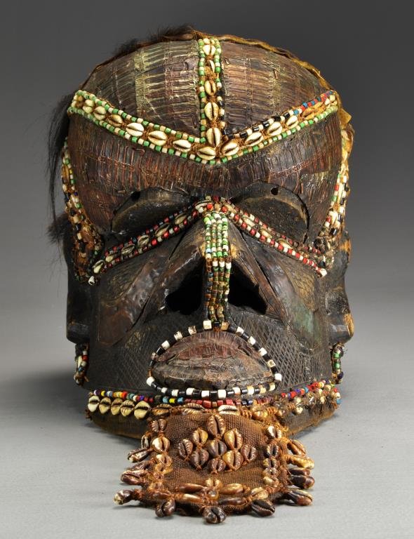 African Congo Kuba Bwoom Helmet Mask: Bwoom mask, Kuba Kingdom, Democratic Republic of the Congo, carved wood, the characteristic Bwoong trident, nose and back of head having extensive colorful beaded and shell decoration, measures approx
