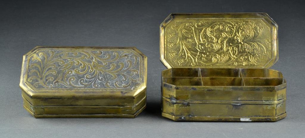 (2) Sri-Lanka, Indo-Persian Brass Boxes: Each having etched decoration to the top depicting birds and floral, each said to hold betel nut for chewing, 5"L, both circa 19th century.