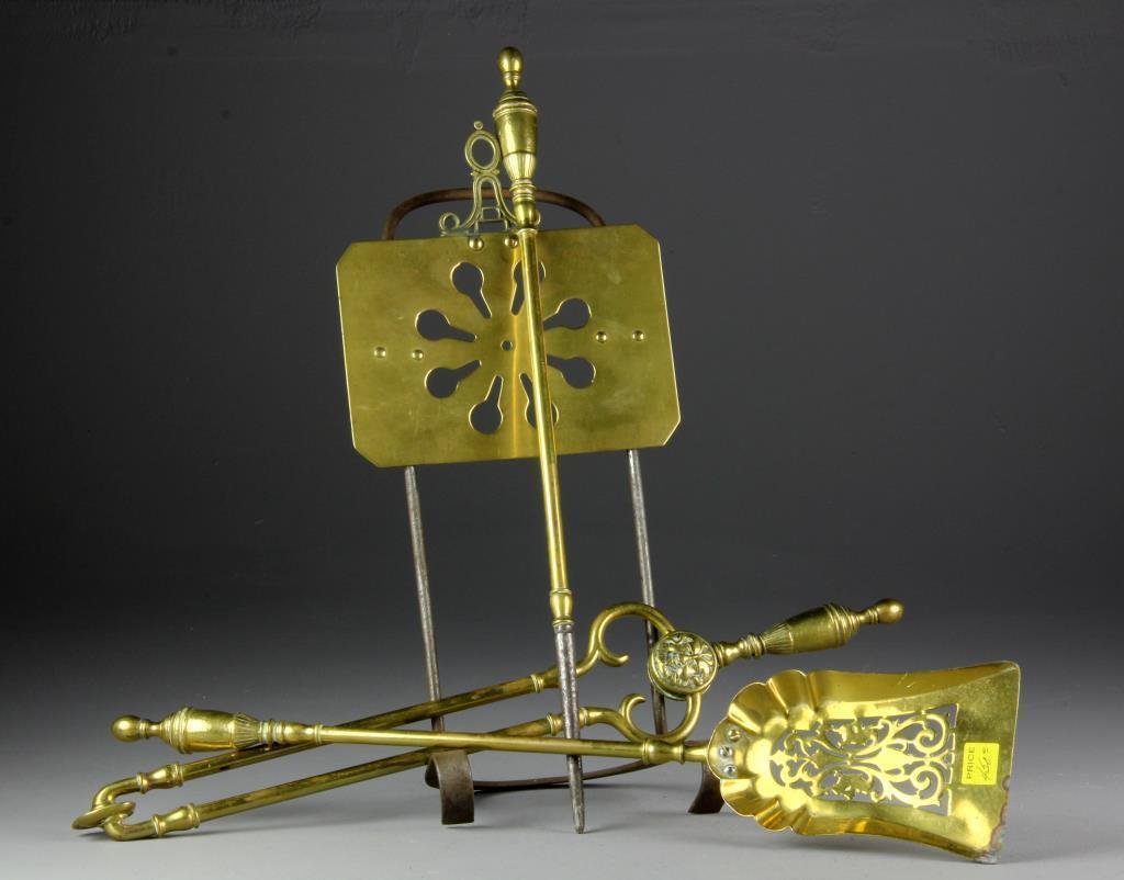 (4) Pcs. Early 20th c. Brass Fireplace Tools & Stand: To include three tools, including a shovel with pierced scroll decoration, a poker, and tongs having figural decoration, all with turned brass handles, together with a pierced brass and steel stand, l