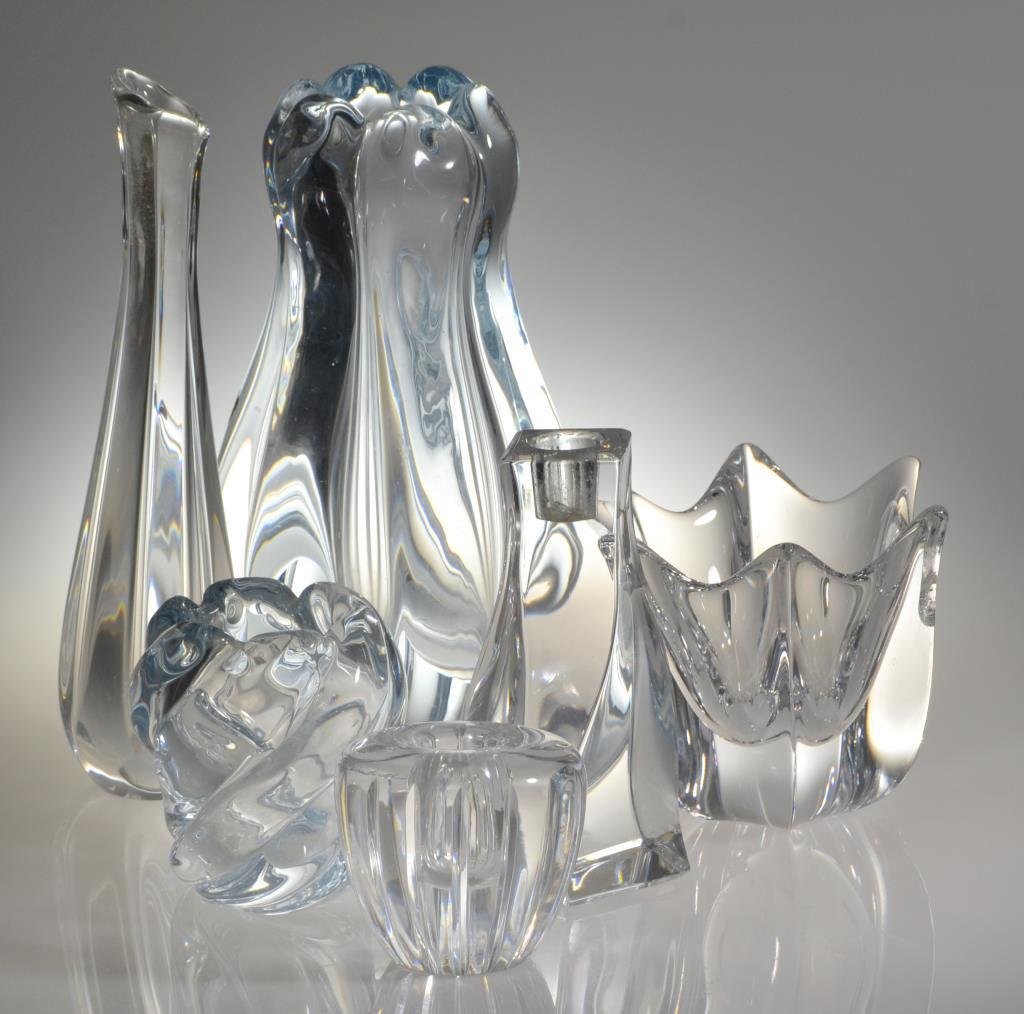 (6) Pcs Orrefors Glass: To include four vases and two candlesticks, two pieces having an aqua tint, largest measures 8.75"H, large vase with rim chips, circa 20th century.