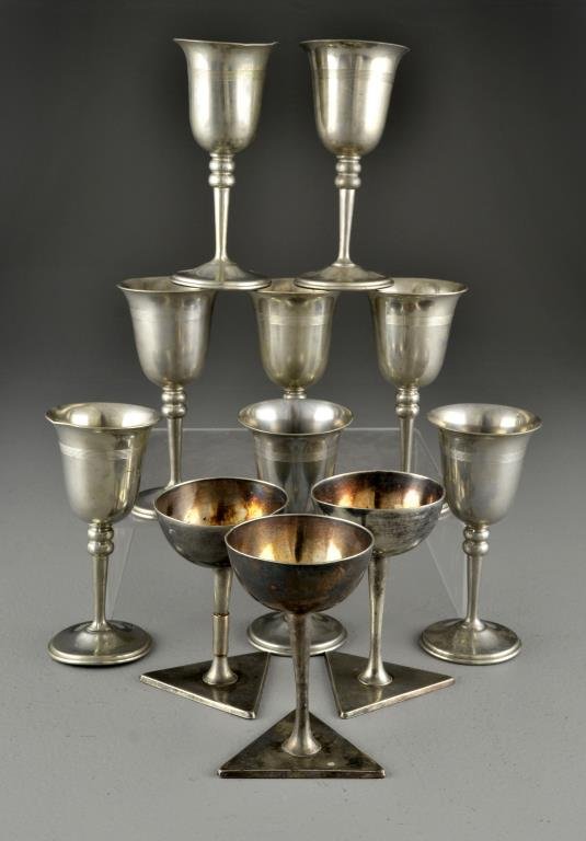 (11) Silver Plate & Pewter Goblets: To include three goblets with a shallow cup and a triangular base, marked Aurora Warranted, Established 1869, and numbered 1000, measure 5"H, together with eight goblets of flared rim with a turned st