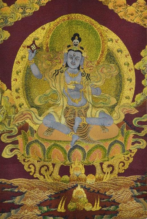 Chinese Buddhist Thangka: Depicting a Buddhist deity at center seated on a lotus throne, having gilt highlights, 34"H X 23.25"W.