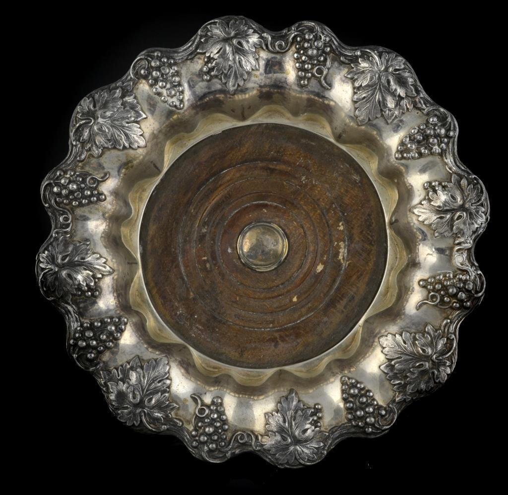 Pr. Old Sheffield Silver Plate Wine Coasters: Having a scalloped edge with embossed grape vine decoration, apparently unmarked, measure 8.25"Dia., circa 20th century. Condition: having normal nicks and abrasions consistent with age and use.