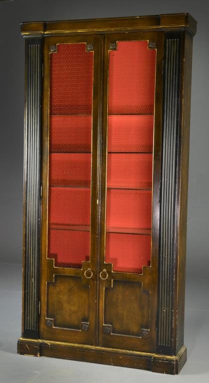 A Neoclassical Style Two Door Cabinet: Having a carved cornice above two doors opening to reveal glass shelves, measures 83.5"H x 42"W x 10.25"D, circa 20th century. Condition, overall wear and surface scratches.