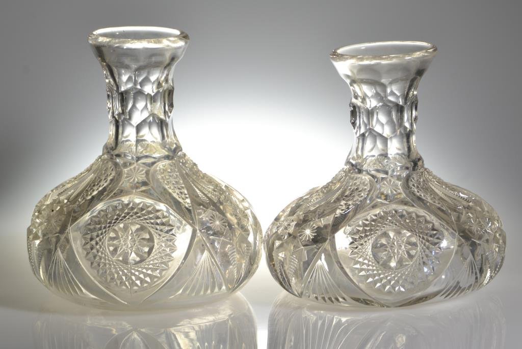(2) Early American Pressed Glass Vases: Mold blown having a grayish tint, decorated with pinwheel pattern, largest measures 8"H, circa early 20th century.