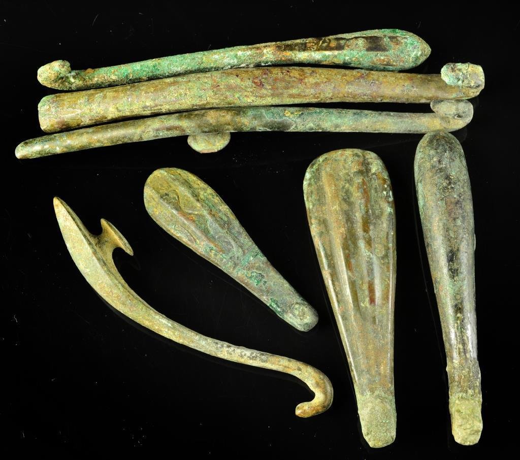 (7) Chinese Warring States Period-Han Garment Hooks: To include seven bronze garment hooks dating from the Warring States Period to the Han Dynasty, largest is 4.75"L. Property of a private Michigan collector who collected these pieces in the 1980's. So