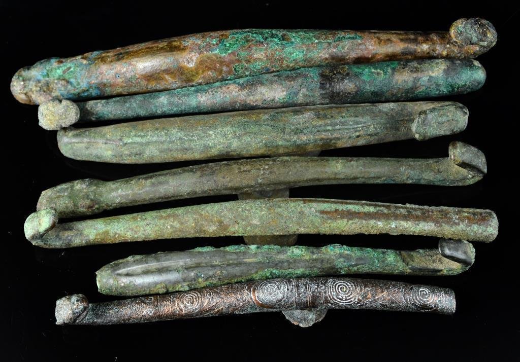 (7) Chinese Warring States Period-Han Garment Hooks: To include seven bronze garment hooks dating from the Warring States Period to the Han Dynasty, largest is 5.5"L. Property of a private Michigan collector who collected these pieces in the 1980's. Som