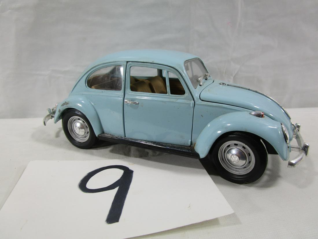 Volkswagen Beetle Metal Car: This Beetle was made by Road Tough and is a replica of the 1967 model. It is missing a back wheel and stands about 3" tall, 8.5" long and 3" wide. It is in pretty nice condition with the exception of 