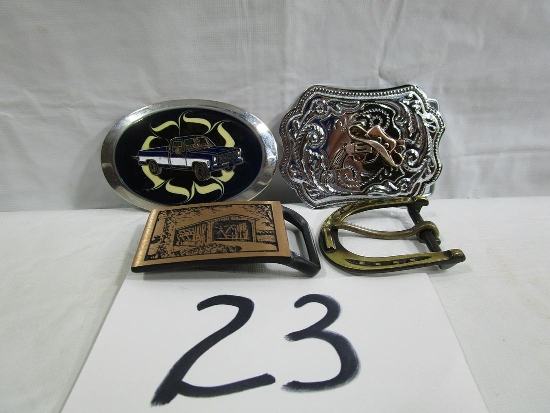 Lot Of 4 Vintage Belt Buckles: This lot includes a very nice western style buckle and also a smaller horseshoe style buckle. There is a Chevy truck buckle that is enameled and a bronze colored finish with a covered bridge on it. Th